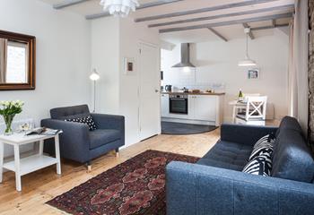 The open plan living space is a cosy base to spend time with a loved one.