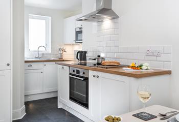 The modern kitchen is sleek and stylish, perfect for cooking up some fine cuisine using local produce. 