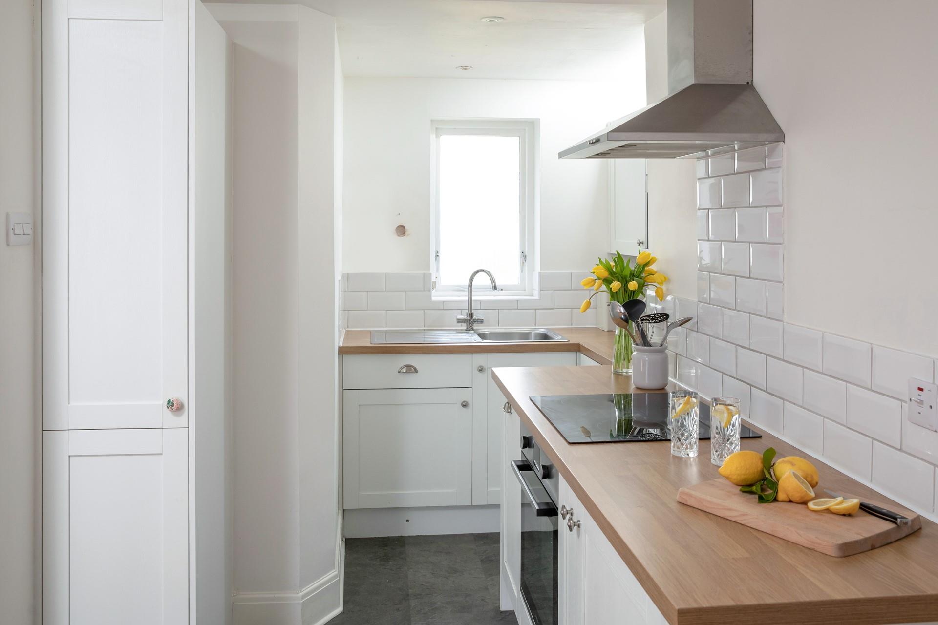 Though compact, the kitchen has been cleverly designed to maximise space.