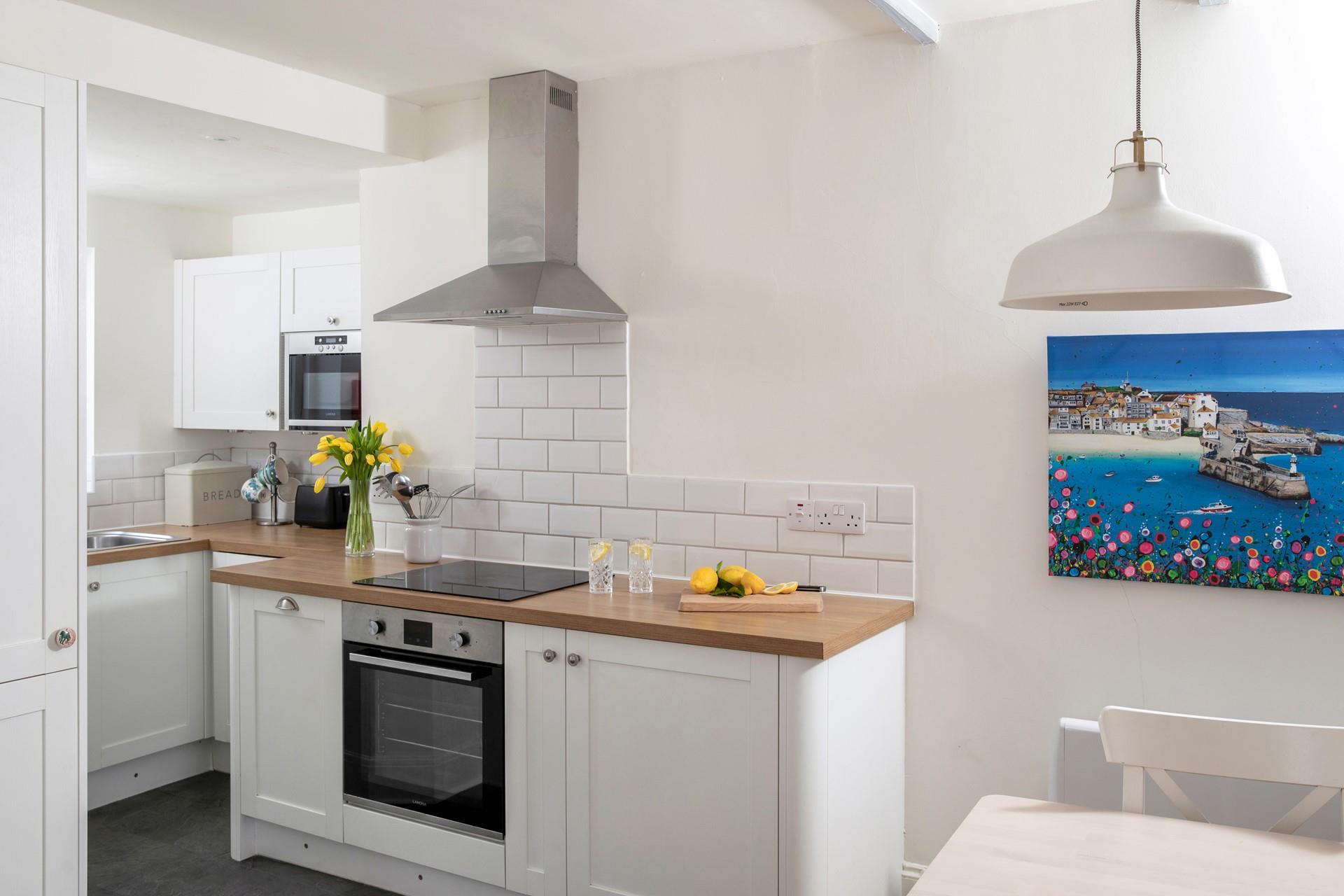 The modern kitchen is sleek and stylish, perfect for cooking up some fine cuisine using local produce. 