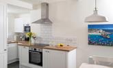 The modern kitchen is sleek and stylish, perfect for cooking up some fine cuisine using local produce.  - Thumbnail Image