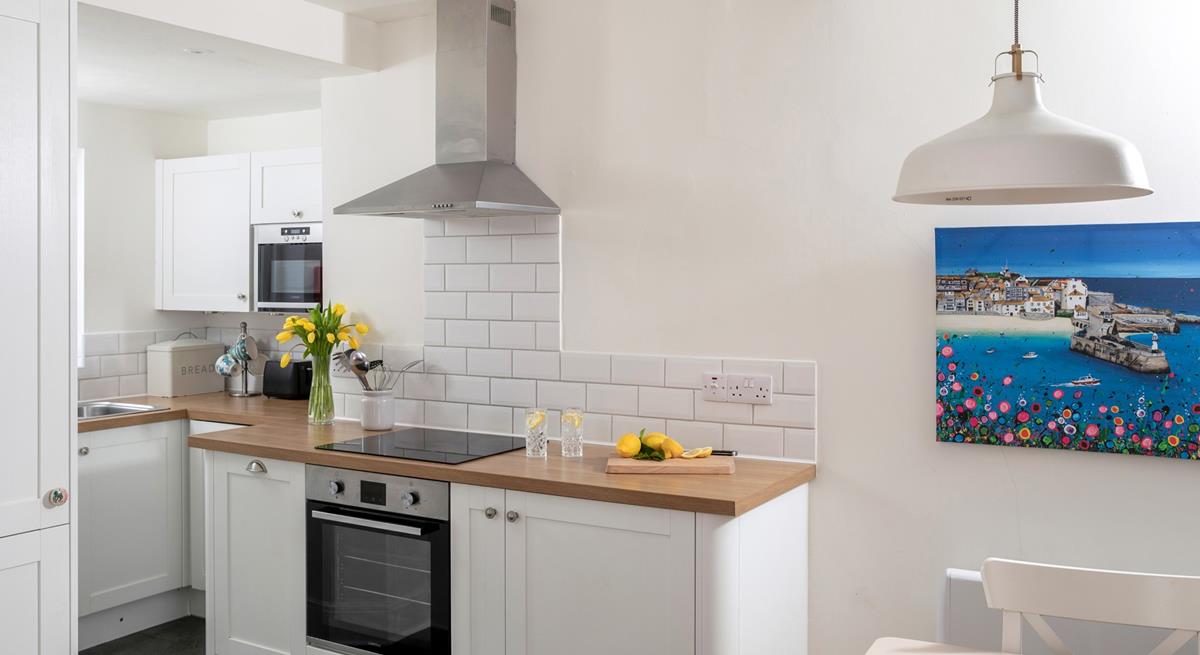 The modern kitchen is sleek and stylish, perfect for cooking up some fine cuisine using local produce. 