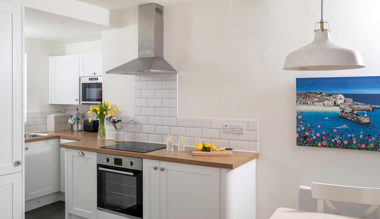 The modern kitchen is sleek and stylish, perfect for cooking up some fine cuisine using local produce. 