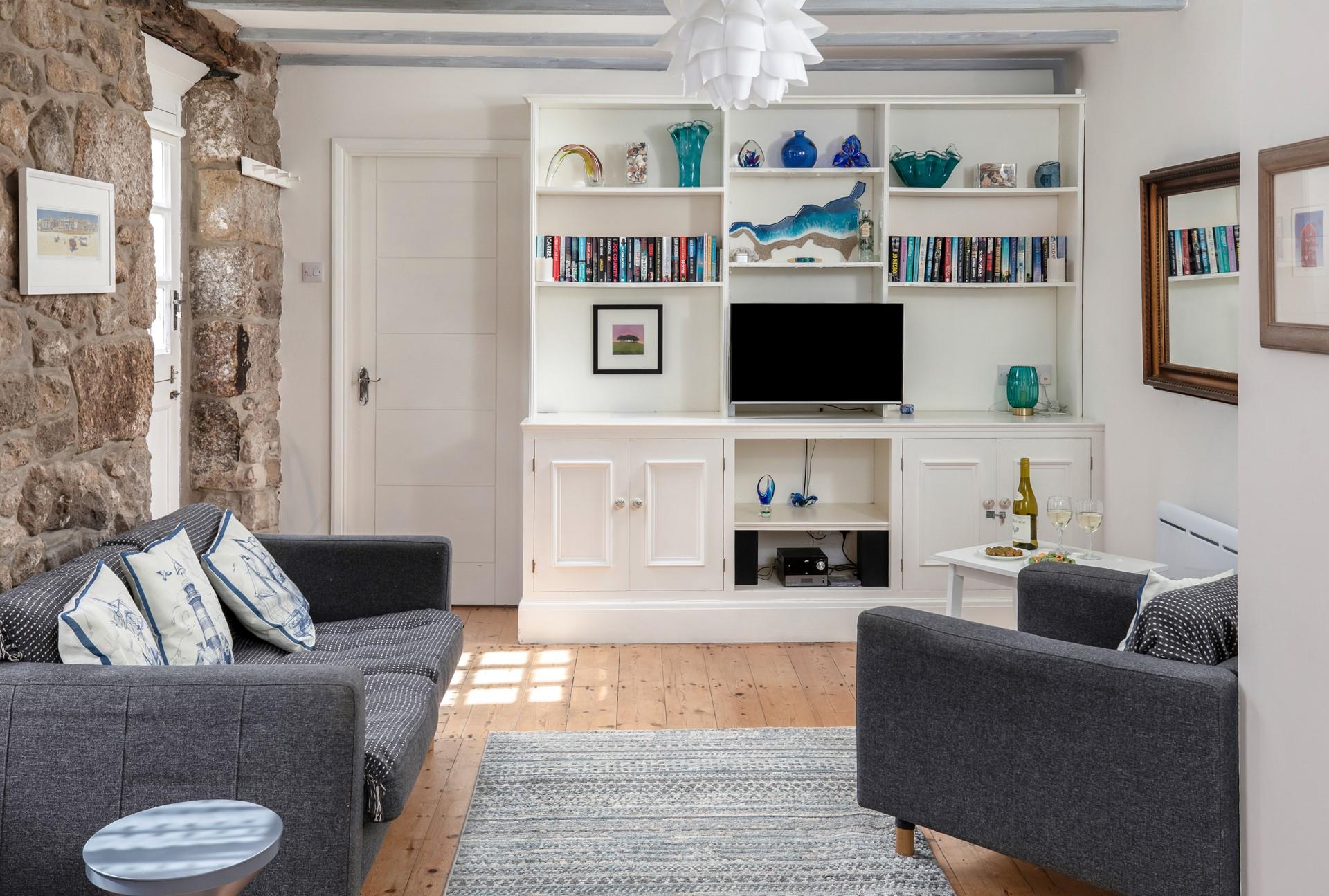 The open plan living space is a cosy base to spend time with a loved one.