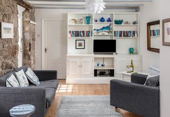 The open plan living space is a cosy base to spend time with a loved one.