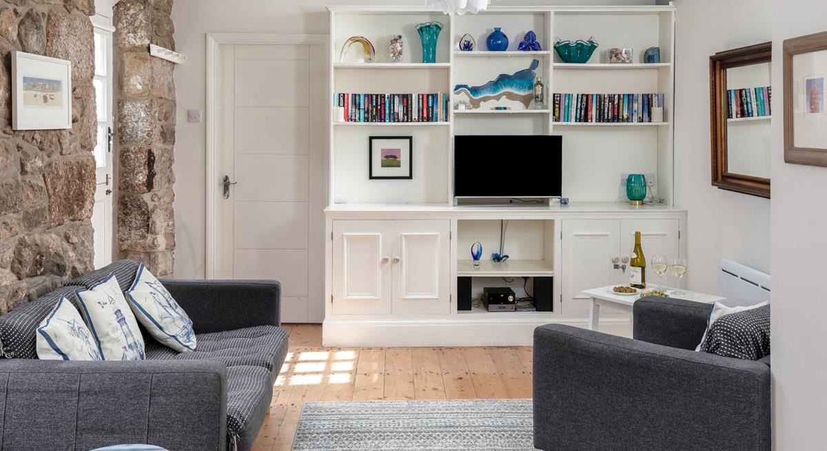 The open plan living space is a cosy base to spend time with a loved one.