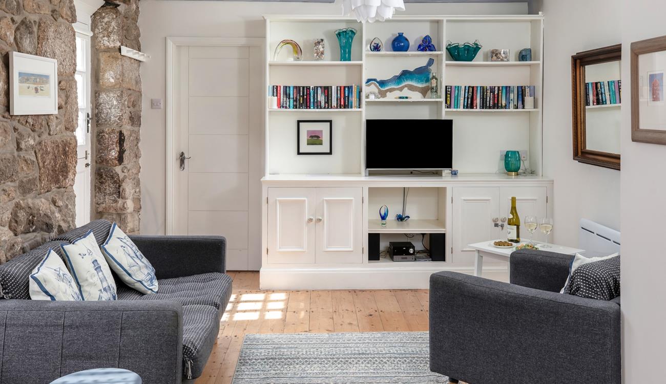 The open plan living space is a cosy base to spend time with a loved one.