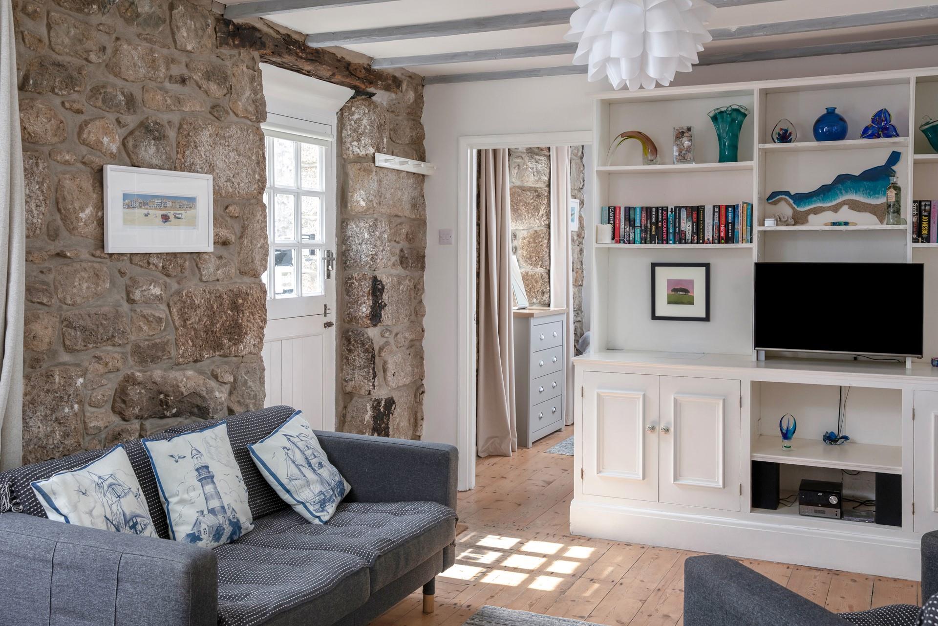 The cottage is full of charm with exposed beams and granite walls.