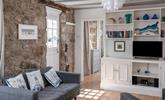 The cottage is full of charm with exposed beams and granite walls. - Thumbnail Image