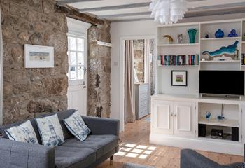 The cottage is full of charm with exposed beams and granite walls.
