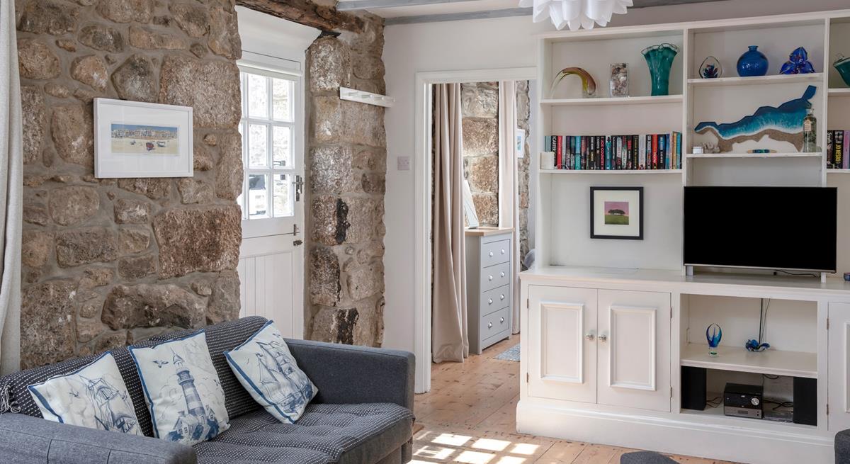 The cottage is full of charm with exposed beams and granite walls.