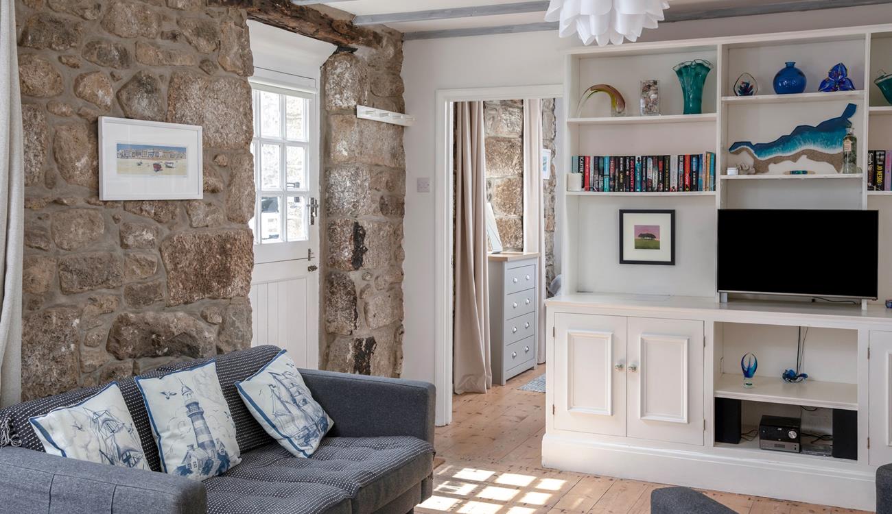 The cottage is full of charm with exposed beams and granite walls.