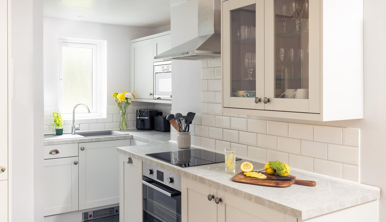 The modern kitchen is sleek and stylish, perfect for cooking up some fine cuisine using local produce. 
