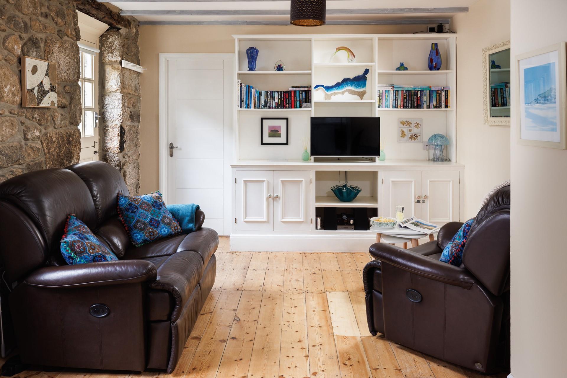 The open plan living space is a cosy base to spend time with a loved one.