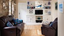 The open plan living space is a cosy base to spend time with a loved one.