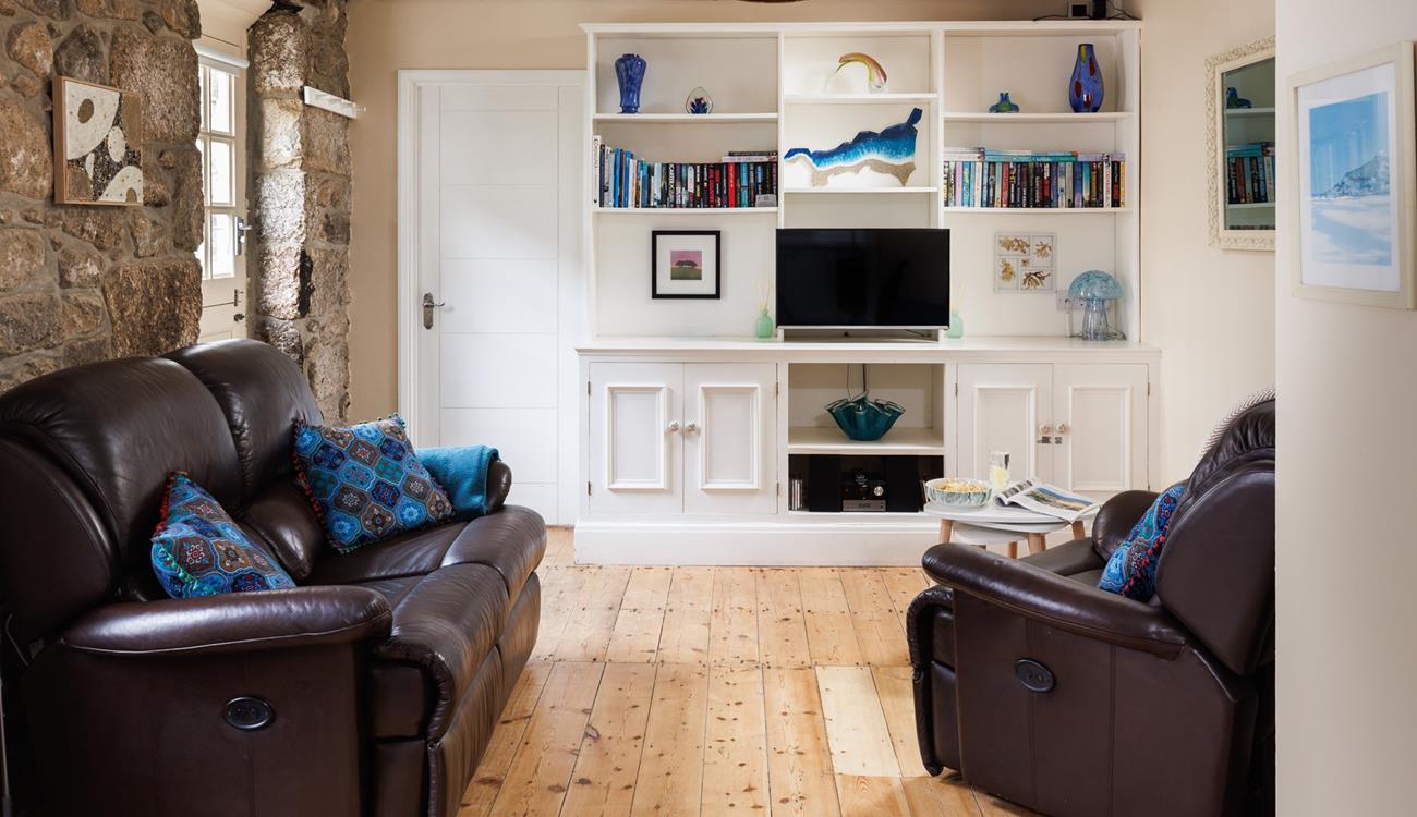The open plan living space is a cosy base to spend time with a loved one.