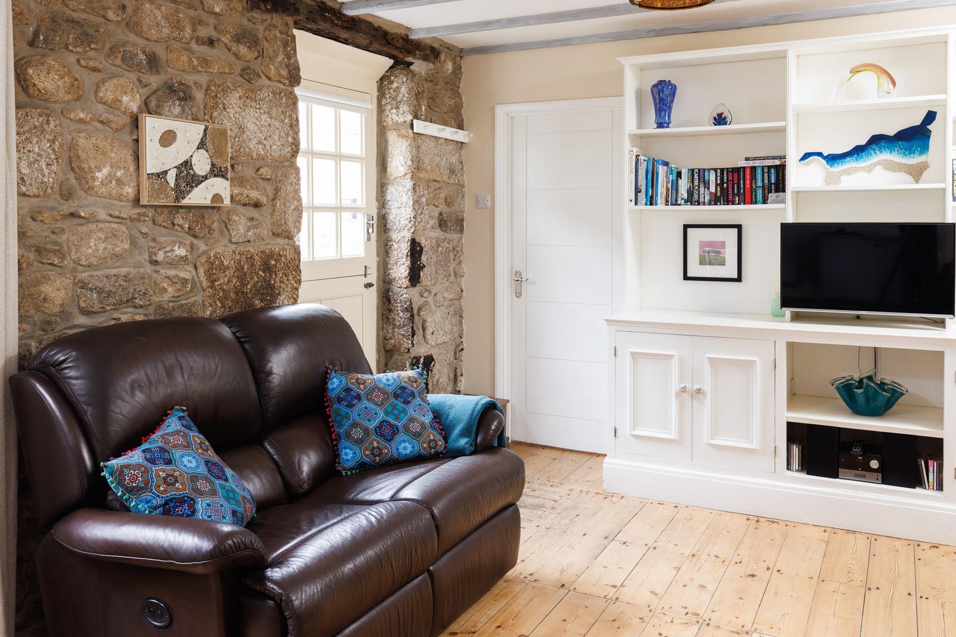 The cottage is full of charm with exposed beams and granite walls.