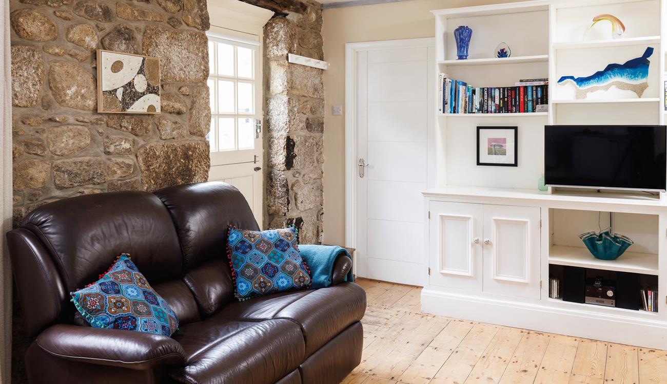 The cottage is full of charm with exposed beams and granite walls.
