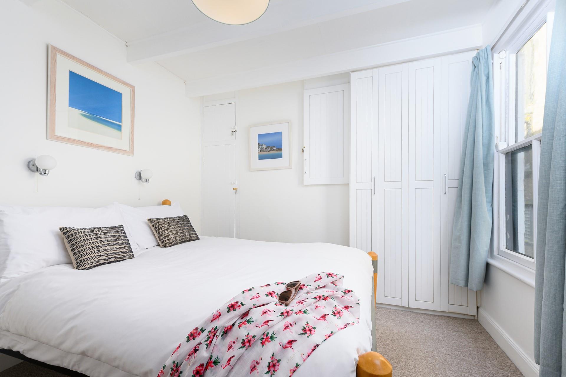 Bedroom 1 is bright and airy, boasting a comfortable double bed and plenty of storage for your holiday best!