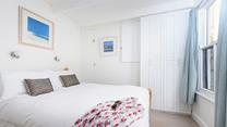 Bedroom 1 is bright and airy, boasting a comfortable double bed and plenty of storage for your holiday best!