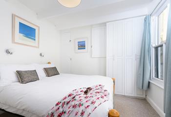 Bedroom 1 is bright and airy, boasting a comfortable double bed and plenty of storage for your holiday best!