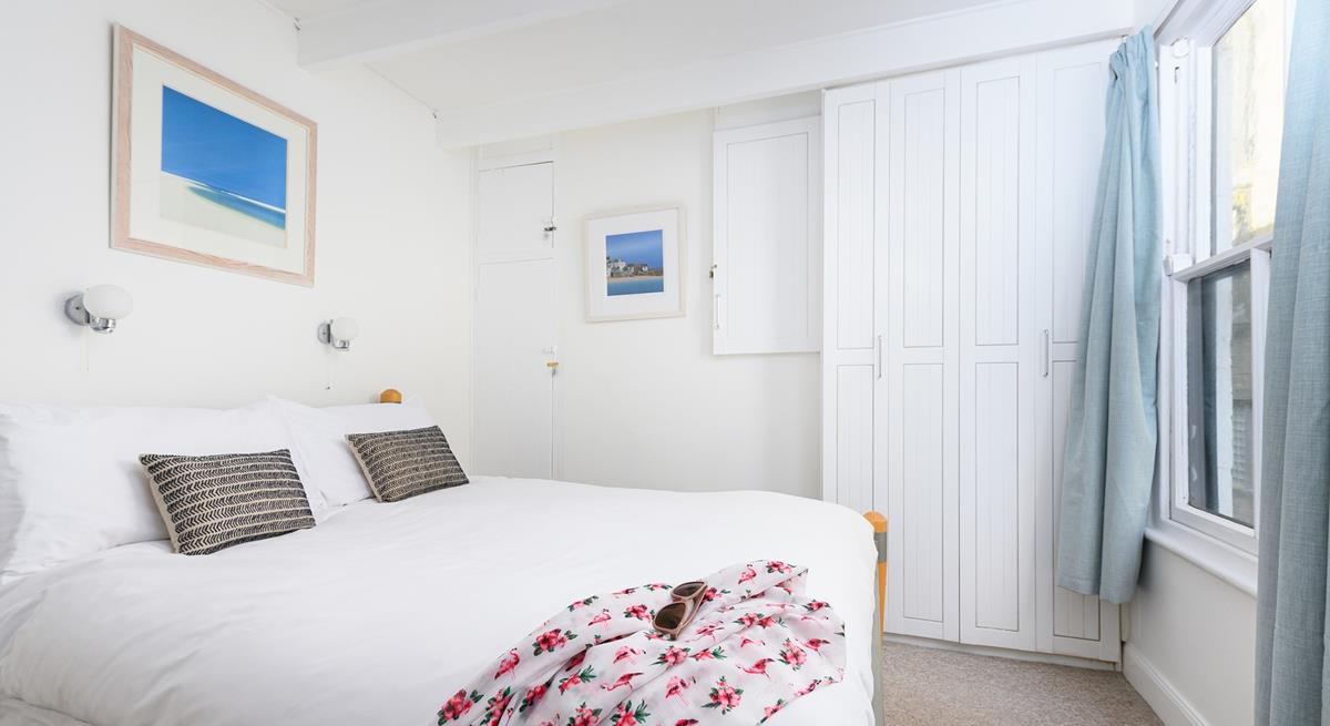 Bedroom 1 is bright and airy, boasting a comfortable double bed and plenty of storage for your holiday best!