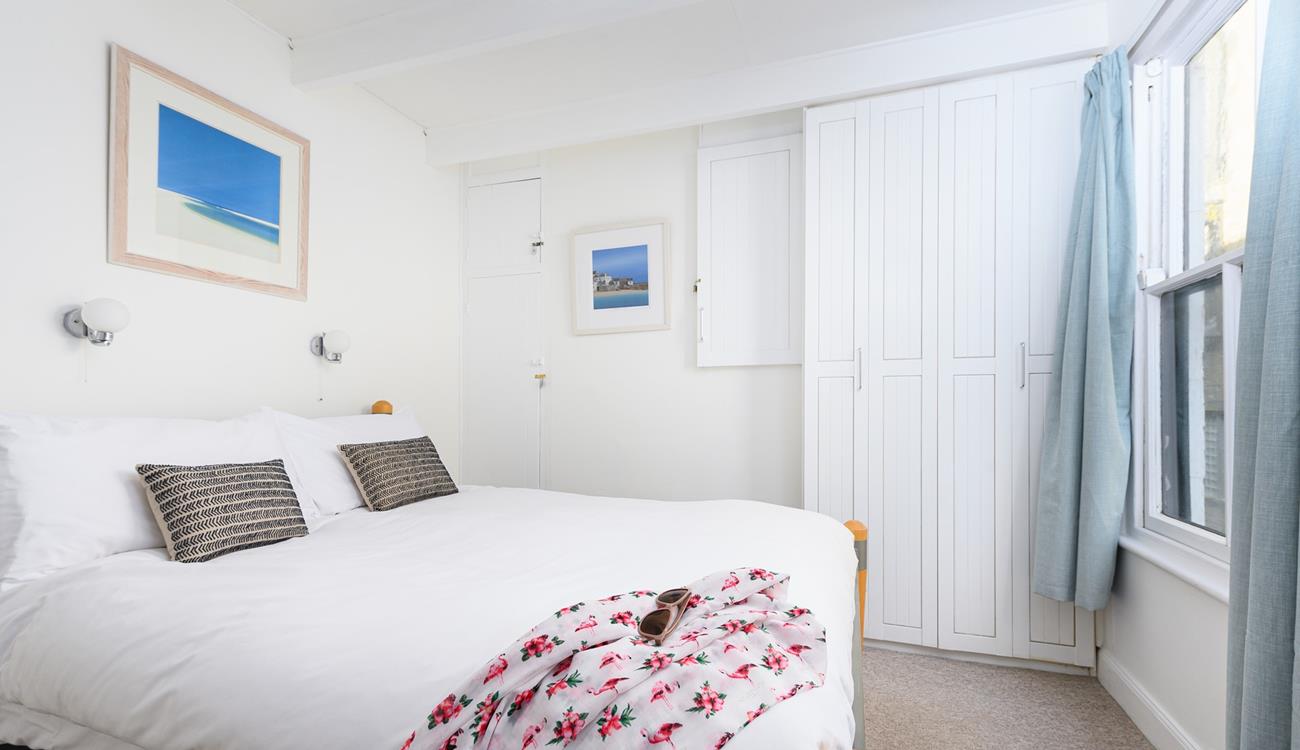 Bedroom 1 is bright and airy, boasting a comfortable double bed and plenty of storage for your holiday best!