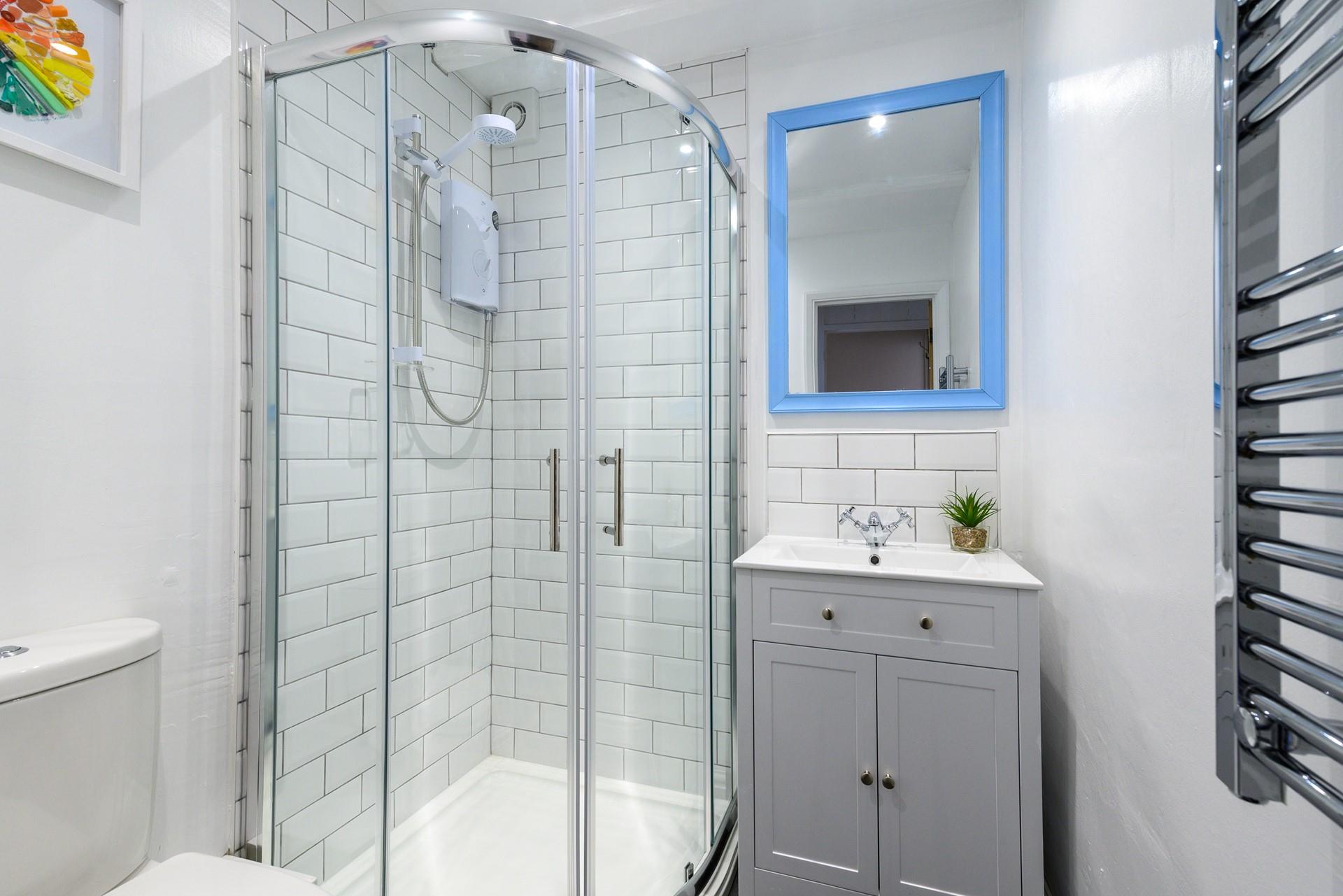 The bathroom has been tastefully designed with modern fixtures and fittings.