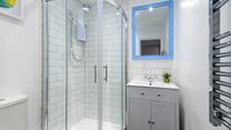 The bathroom has been tastefully designed with modern fixtures and fittings.