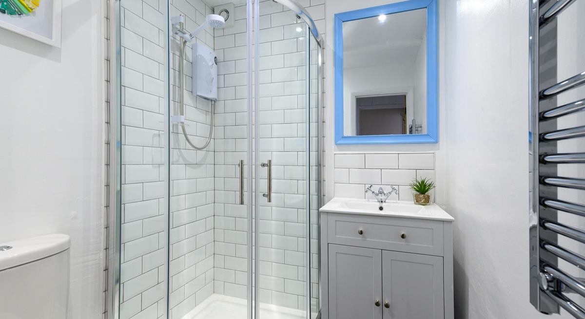 The bathroom has been tastefully designed with modern fixtures and fittings.