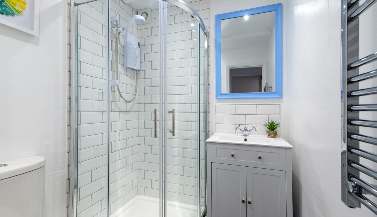 The bathroom has been tastefully designed with modern fixtures and fittings.