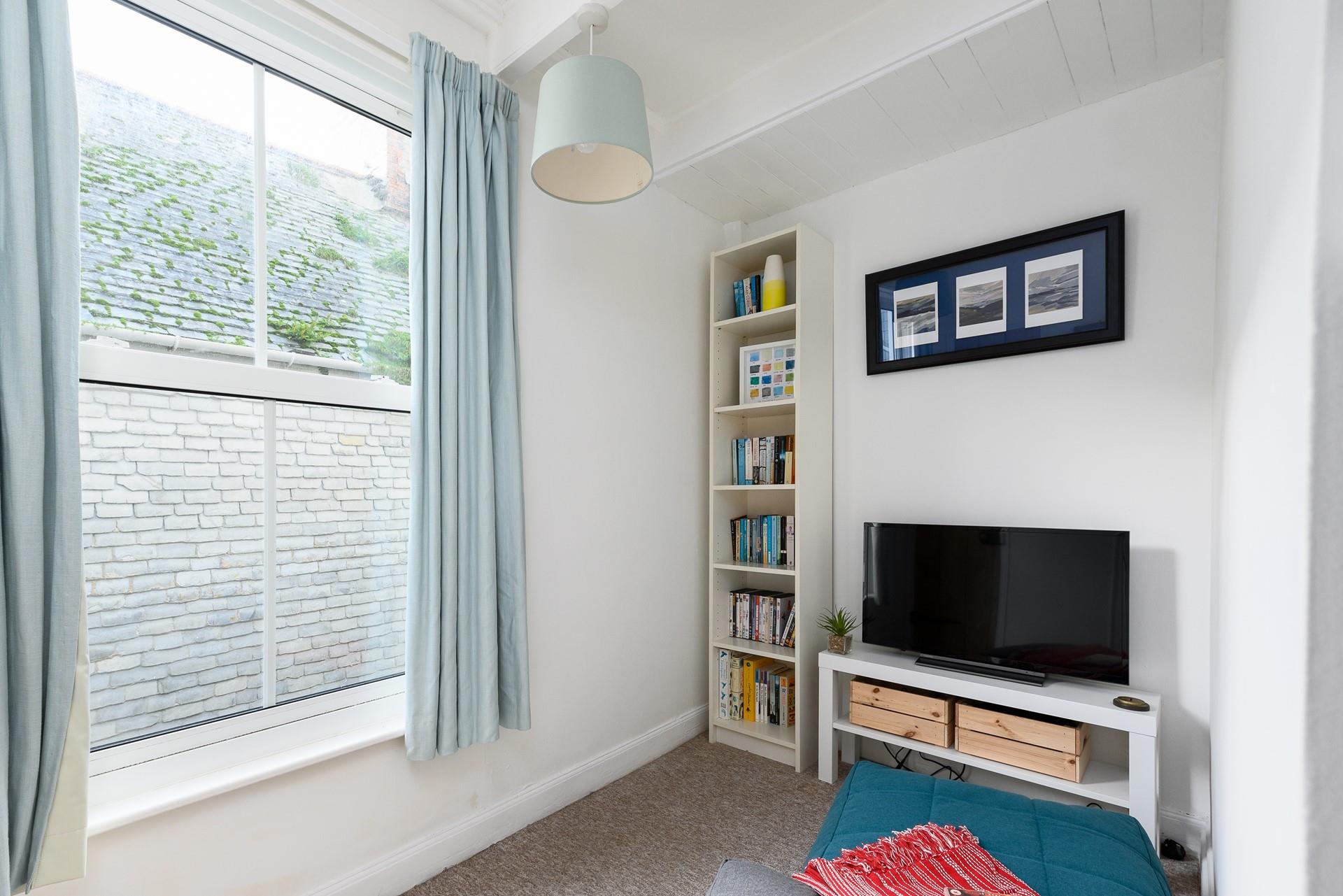 The snug area with books, games console and TV is sure to delight both children and teenagers.