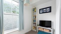 The snug area with books, games console and TV is sure to delight both children and teenagers.