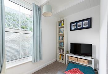 The snug area with books, games console and TV is sure to delight both children and teenagers.