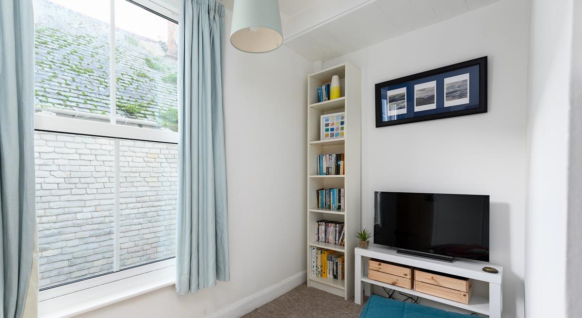 The snug area with books, games console and TV is sure to delight both children and teenagers.