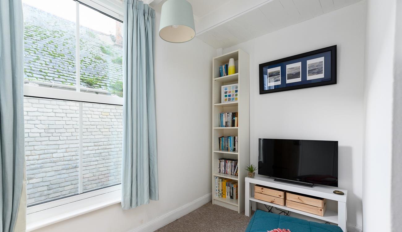 The snug area with books, games console and TV is sure to delight both children and teenagers.