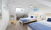 Bedroom 2 has twin beds that are perfect for children or friends sharing. - Thumbnail Image