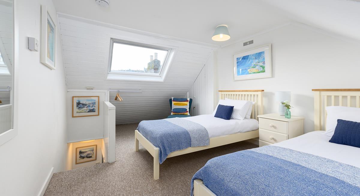 Bedroom 2 has twin beds that are perfect for children or friends sharing.
