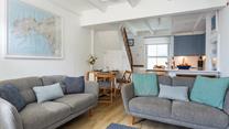 Traditional features such as exposed beams add to the property's character.