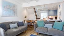 Soft tones and cosy furnishings have created a welcoming space to relax with your loved ones.