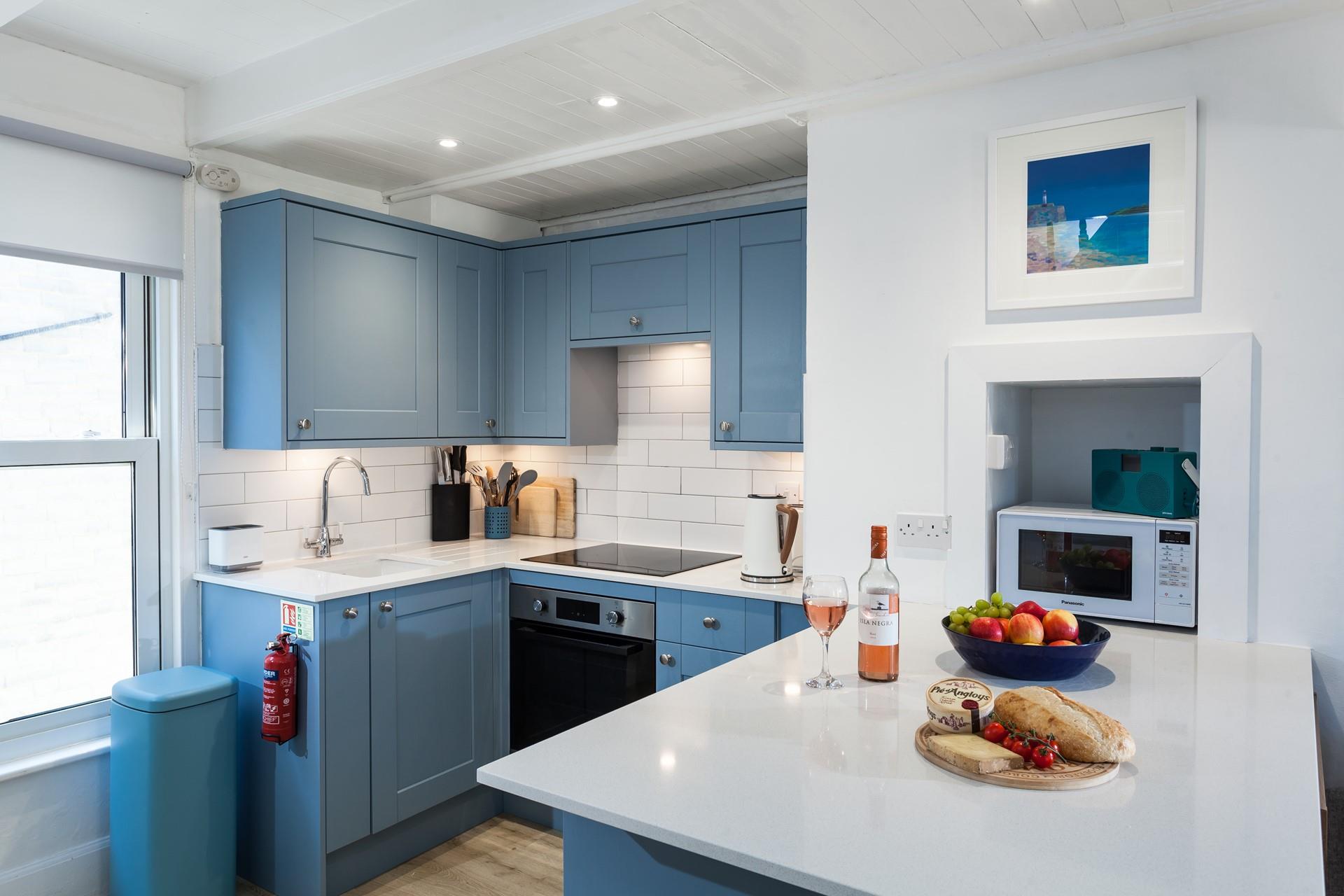 Though compact, the kitchen has been thoughtfully designed to make cooking up delicious meals a breeze.