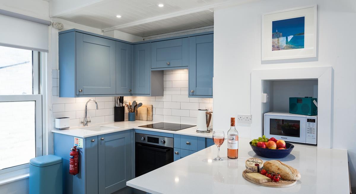 Though compact, the kitchen has been thoughtfully designed to make cooking up delicious meals a breeze.