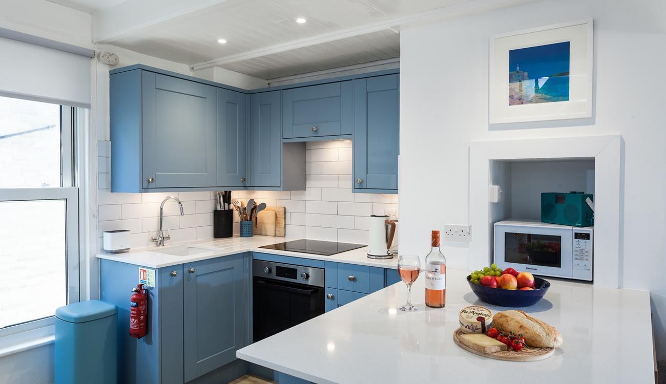 Though compact, the kitchen has been thoughtfully designed to make cooking up delicious meals a breeze.