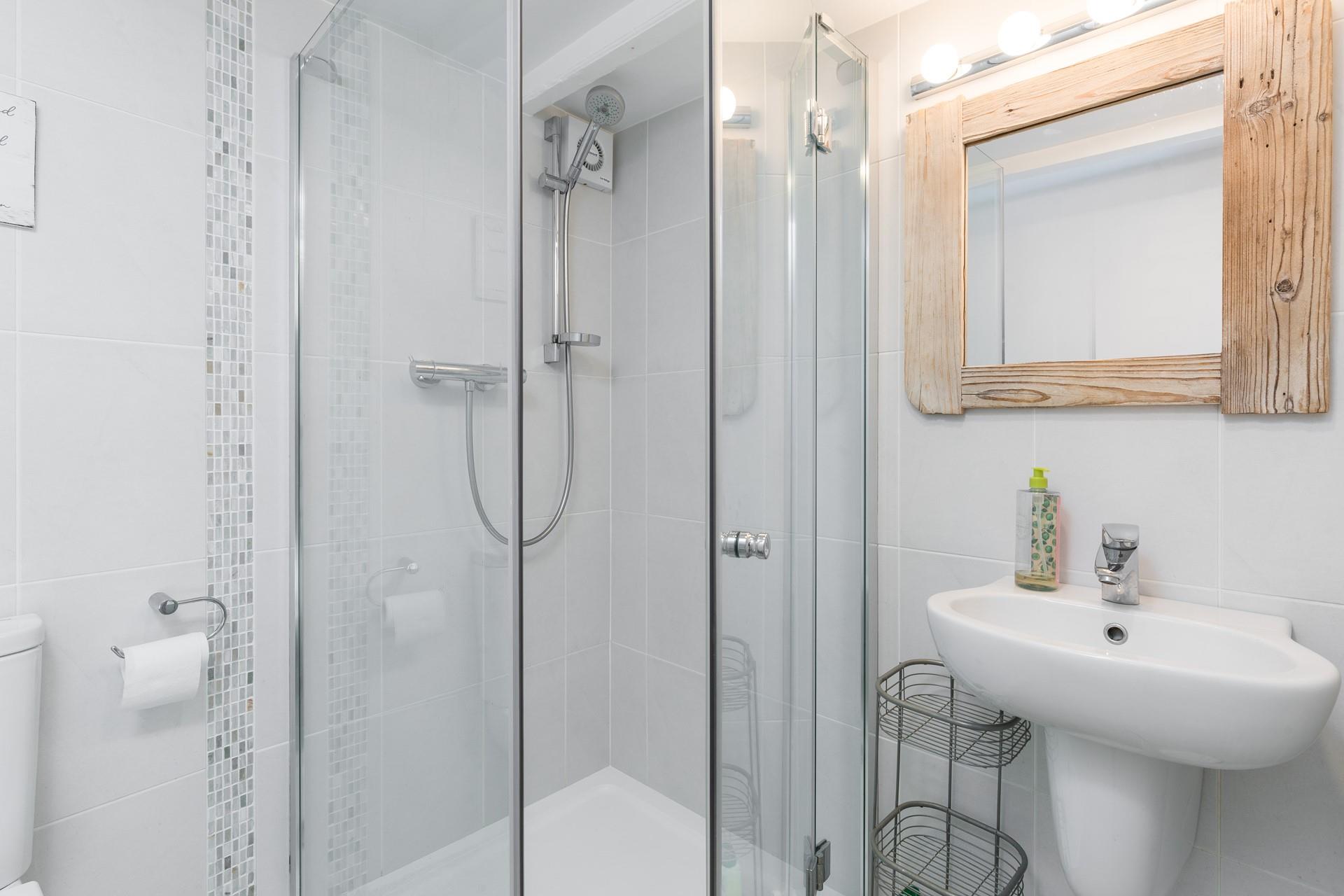 Step into the shower for a refreshing rinse after a day on the beach.