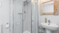 Step into the shower for a refreshing rinse after a day on the beach.