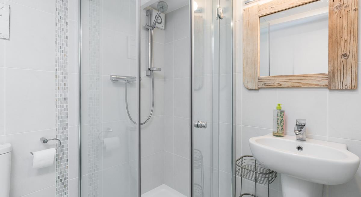 Step into the shower for a refreshing rinse after a day on the beach.