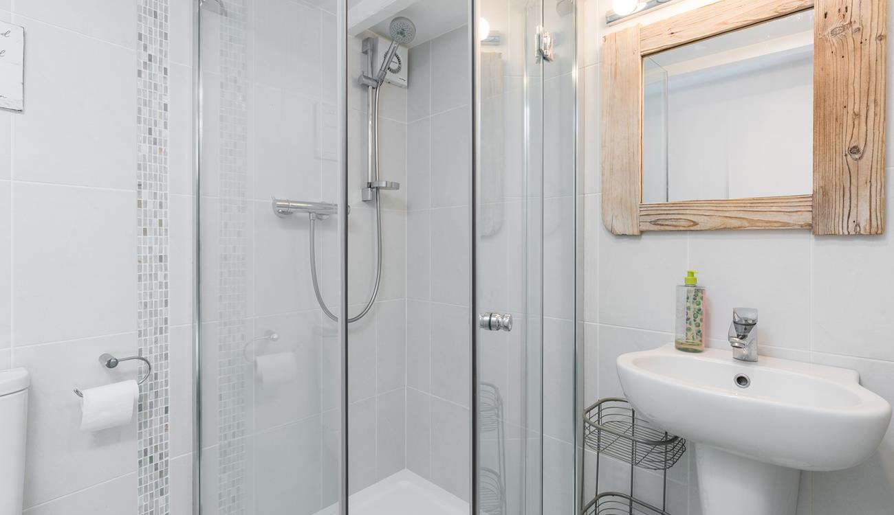 Step into the shower for a refreshing rinse after a day on the beach.