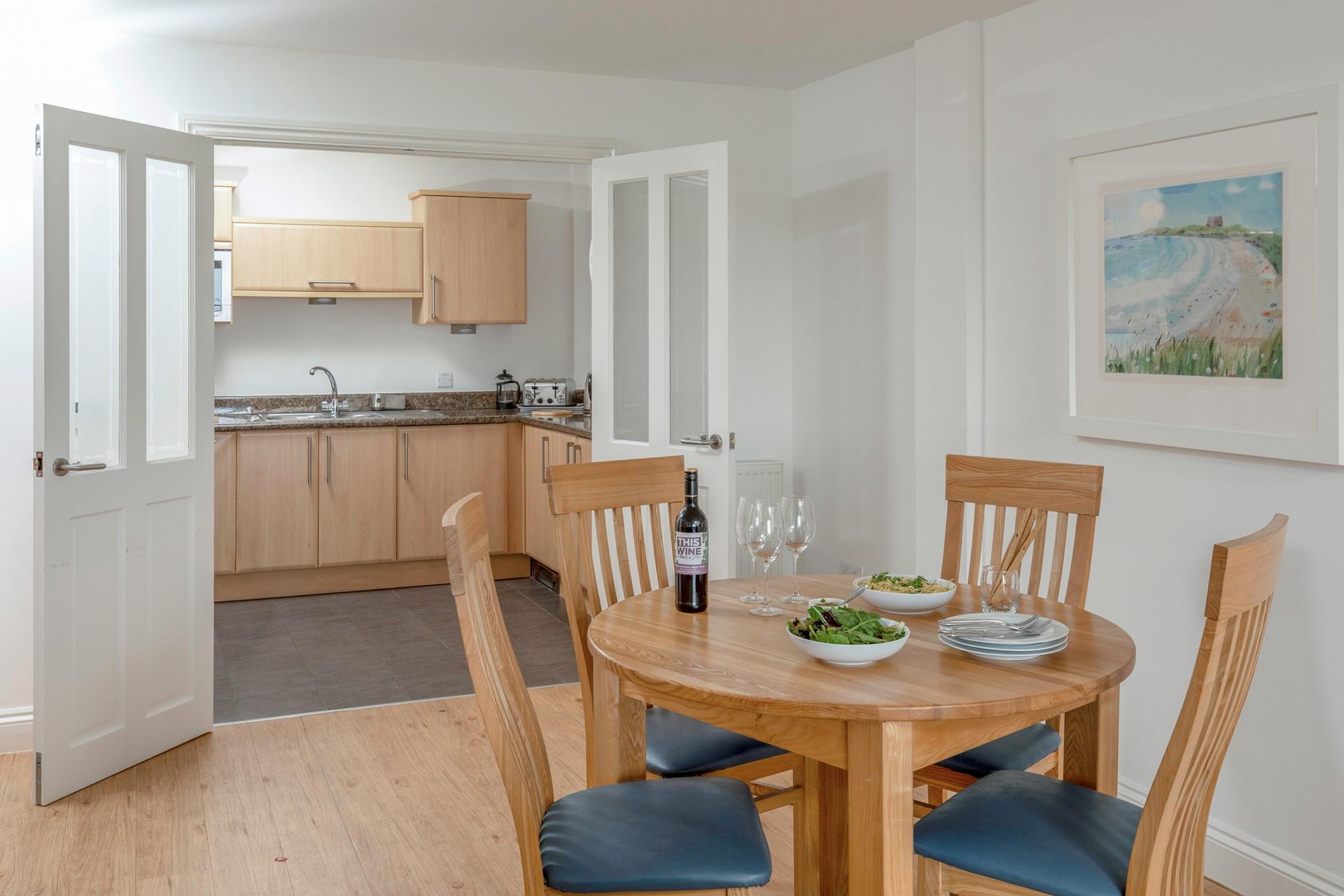 Double doors to the kitchen create the perfect space for cooking and dining together.