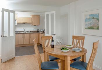 Double doors to the kitchen create the perfect space for cooking and dining together.