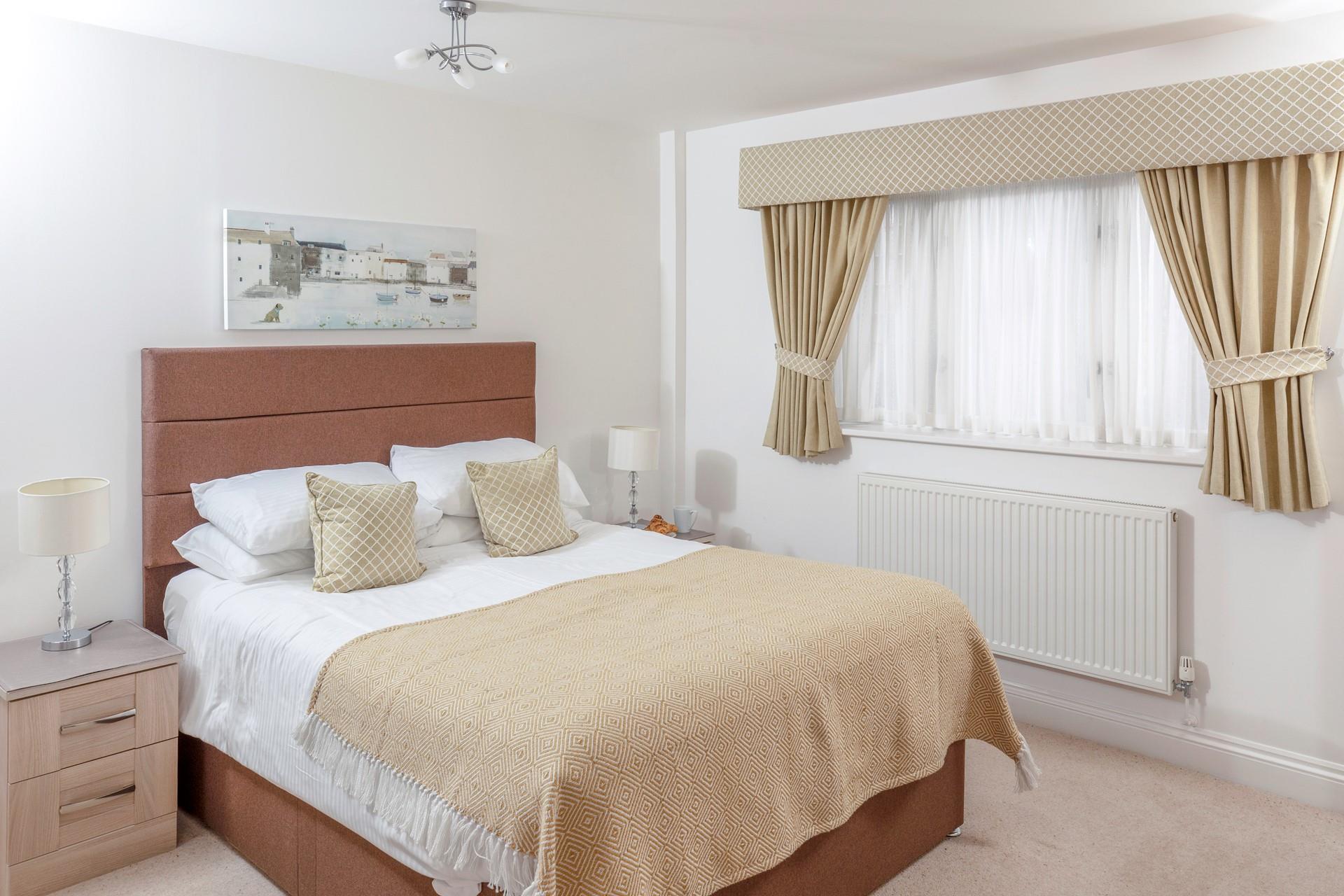 The double bedroom is a calming retreat where you are sure to sleep soundly.